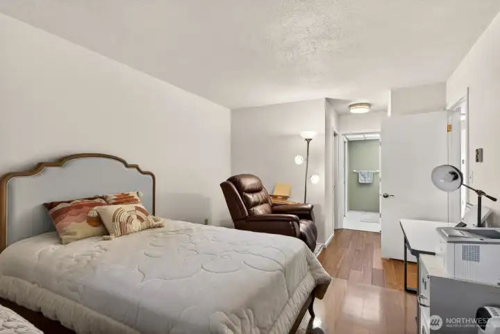 Roomy Primary Suite with updated flooring & blinds. Walk-in closet PLUS extra large closet.