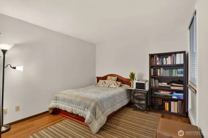 Generous 2nd Bedroom with updated flooring & blinds AND walk-in closet.