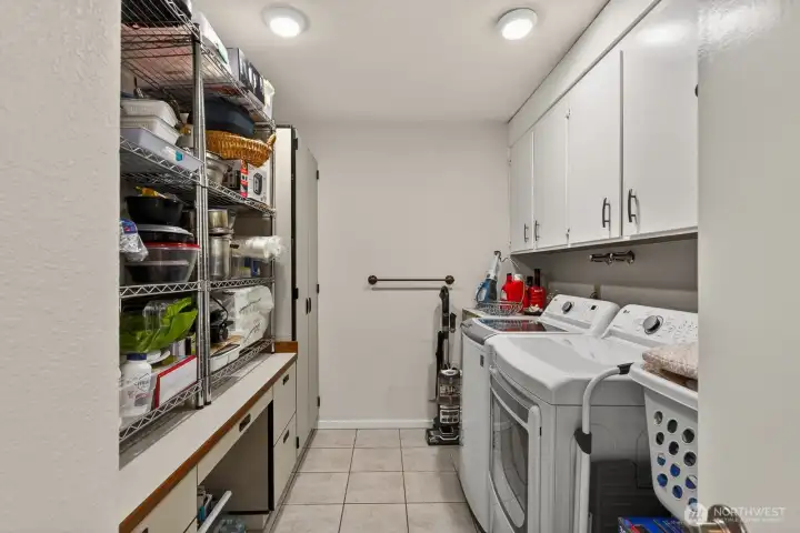 Large in unit laundry with plenty of storage.