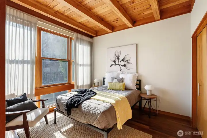 Second bedroom with exposed wood ceiling