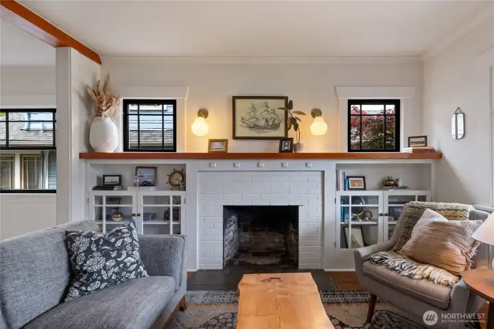 Current owners used salvaged bleachers from Seattle Lutheran High School to recreate a classic mantle and beam.