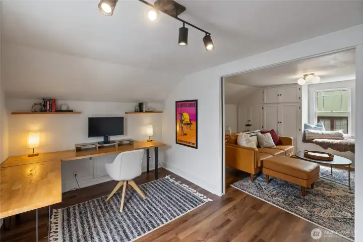This office space could be considered a fourth bedroom albeit's access is through the main suite/media area.