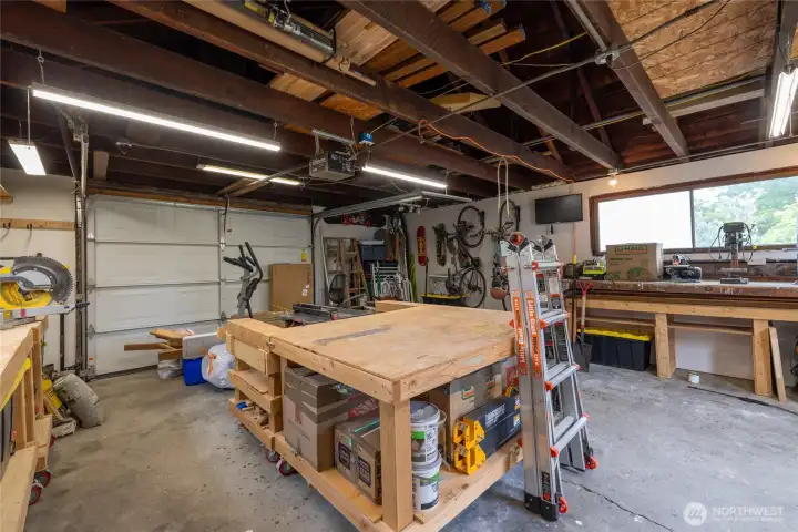 This garage offers a 120 amp sub panel and tons of workspace!