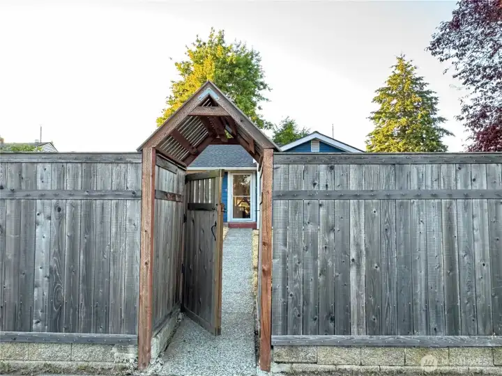 Just on the other side of this gate you will find the most adorable 2 bedroom home in North Tacoma!