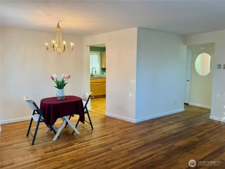 Living/dining area.  Door adjacent to the table leads into the kithen.  Just around the corner if you go straight you will enter the hallway.  To your left is the blue bedroom...to the right is the tan bedroom.  Almost straight ahead is the bathroom.