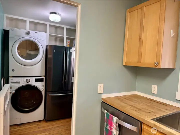 Stack washer/dryer...new in 2023 and refrigerator all stay as a convenience to buyer.  Electrical panel new in 2004!