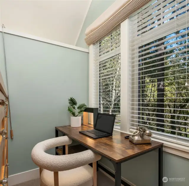 A special 'work from home' privacy niche is included in the large walk in closet and overlooks the woodland.