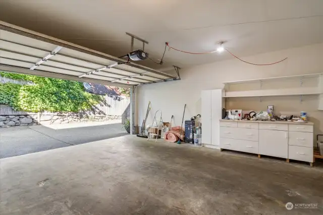 spacious 2-car garage with dedicated workspace