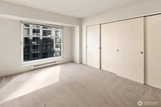 Primary bedroom with double closets.