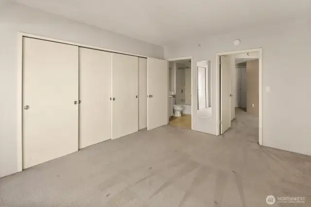 Another angle of the primary bedroom looking towards the ensuite bathroom.