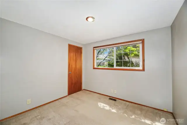 BEDROOM #3  Closet with single door  Window overlooks front yard