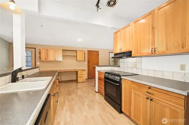 Black appliances include microwave, stove and:     2023 Dishwasher      2017 Side by side refrigerator  Specialty cabinets:             built in wine rack, built in door spice rack, pull out shelves,            extra deep drawers  Dual sinks with pull out wand