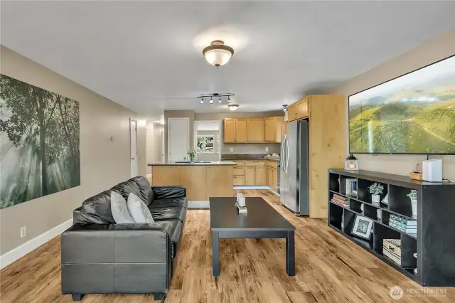 Vinyl plank flooring throughout the whole home adds to the aesthetic. The walls are freshly painted.