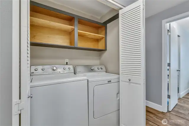 Full-sized washer and dryer are included for the new owner.  They are conveniently located in the hallway near the bedrooms. Some built in storage for al your laundry supplies.