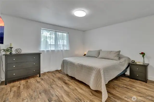 Spacious primary bedroom has its own full bathroom with two sinks, as well as a walk-in closet. Again, fresh paint and vinyl plank flooring thoughout.