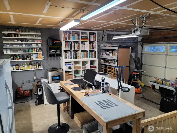 Expansive 300 sq.ft. insulated garage with 240V power was used by the seller as his office/mancave. Imagine the possibilities in addition to just parking your car!