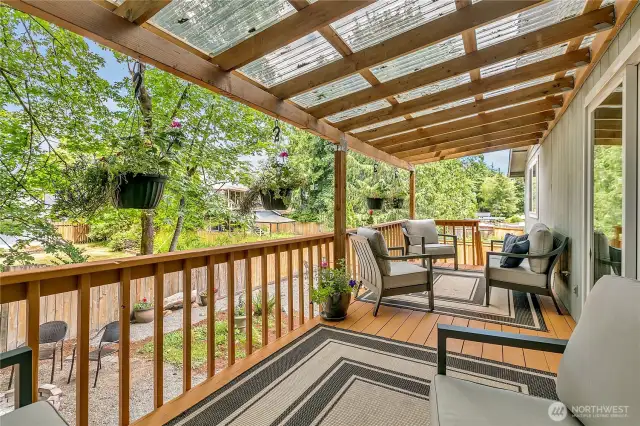 Another view of the covered deck in back of the home,