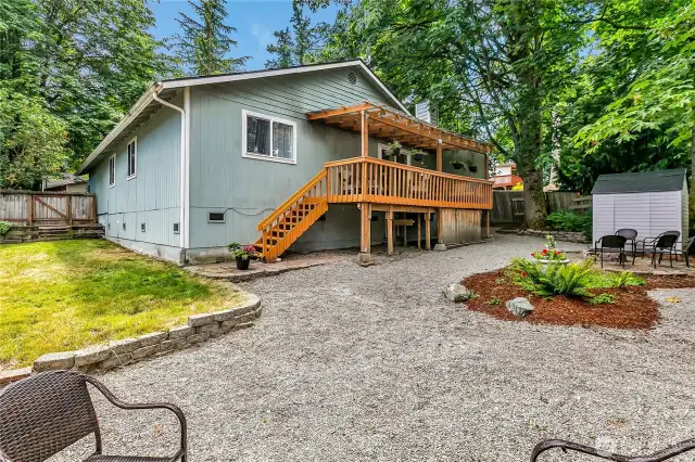 View of the backyard and covered deck.