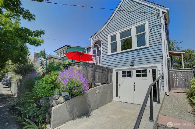 Perched above the street sits this blue cutie. Front patio is great for dining outside in the summers or enjoying the morning sun and coffee. Great neighbors!