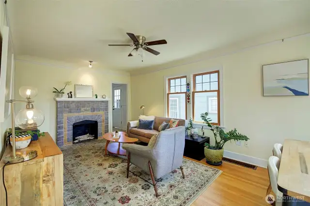 An abundance of natural light fills this room. Doorway to right leads into kitchen.