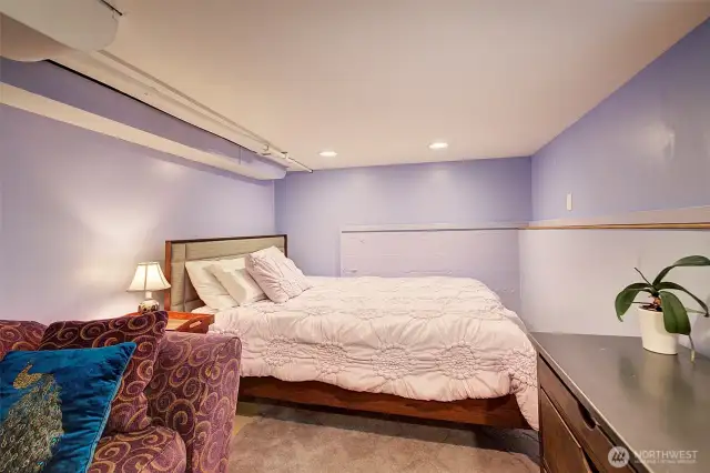This is a queen sized bed in here. This would also make a good workout space.