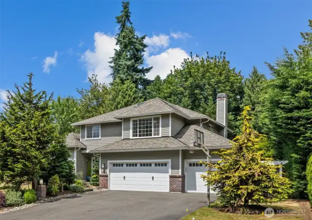 Welcome home!  Three-car garage has two very deep bays creating extra shop space or potentially parking for more than three vehicles.