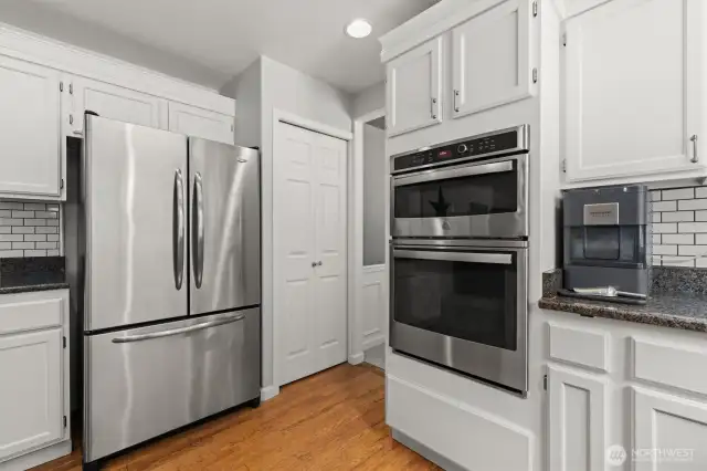 This angle shows the kitchen pantry on the way towards the dining room.