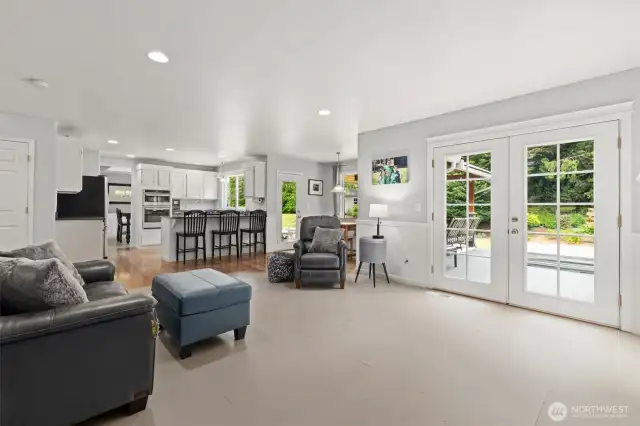 French doors lead out to the back deck and covered entertaining area.