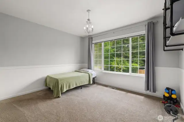 Another of the four bedrooms upstairs.  Notice the greenbelt views from all the windows in the house.