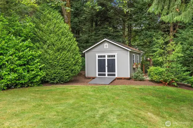 Cute and functional garden shed in the back corner of the property.