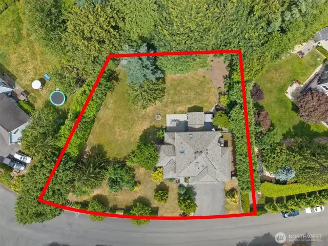 This aerial shot shows the approximate property lines.  Yard is fully fenced.