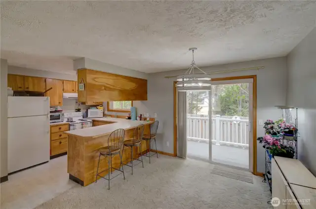 Sliding door leads to the fully fenced back yard.