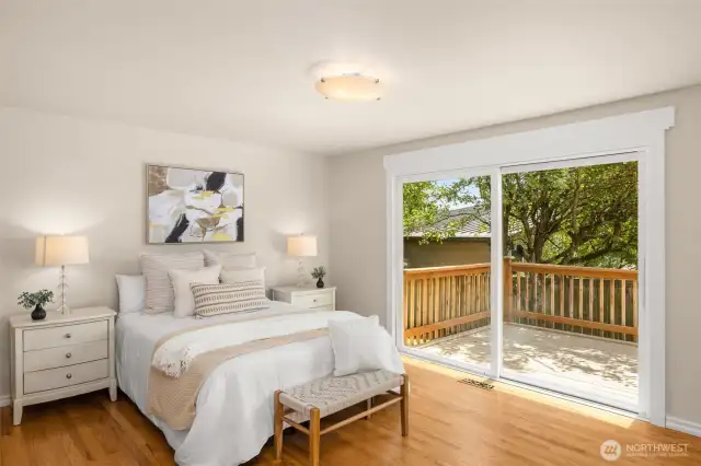Primary bedroom with gorgeous views of the lake.