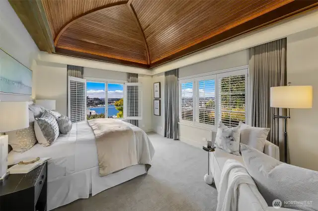 Custom wood vaulted ceilings with recessed lighting.