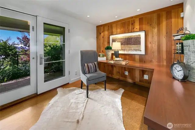 The home office in the lower level with a serene outlook to established greenspace and views to the west.