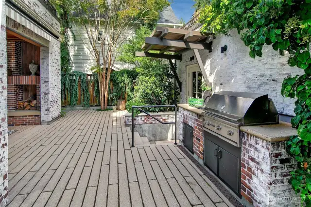 Outdoor entertaining area complete with built-in barbecue, deck, patios and spaces to dine alfresco.