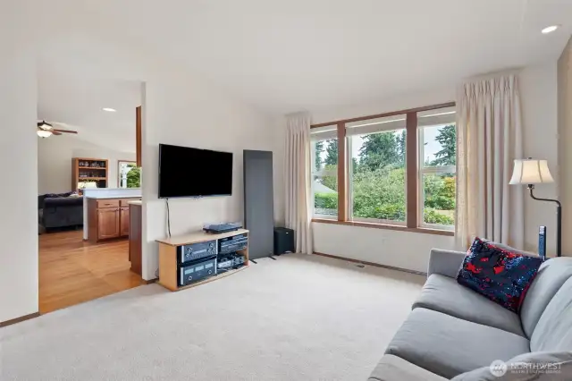 View from dining space into the kitchen and its beautiful real hardwood floors.