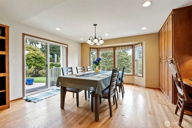 Another view of the breakfast area that leads out to and looks out over the patio and backyard beyond.