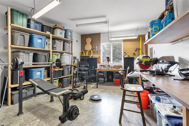 The heated work shop area has plenty of room for storage and multitasking such as workshop space, music room, workout room, and more. What would you use this gorgeous space for?