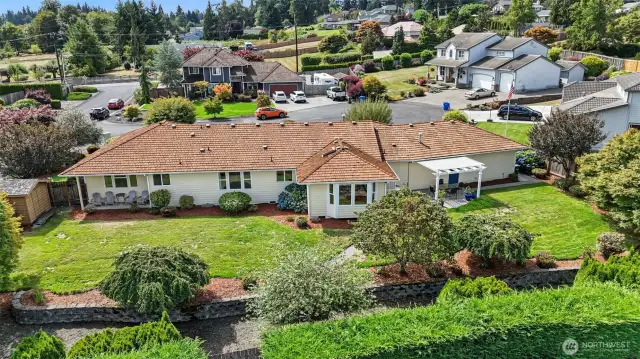Arial View of the back of the home and the stunning back yard.