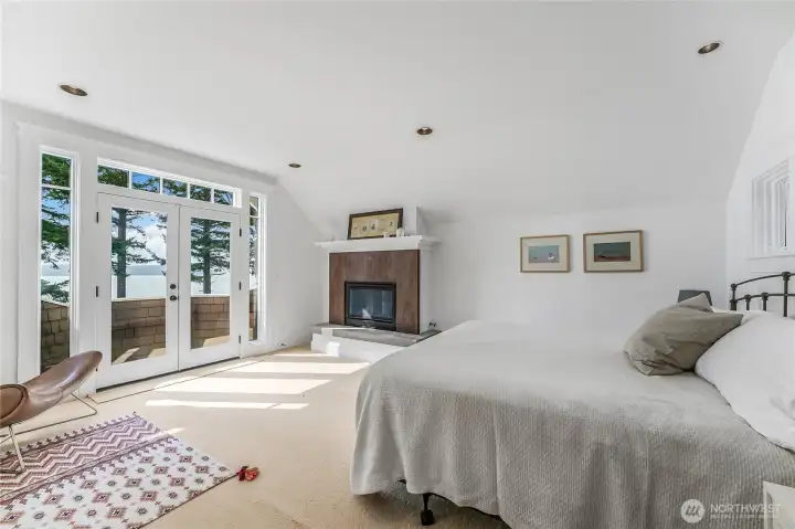 The primary bedroom is complete with Juliet balcony, walk-in closet, 5 piece ensuite and gas fireplace.