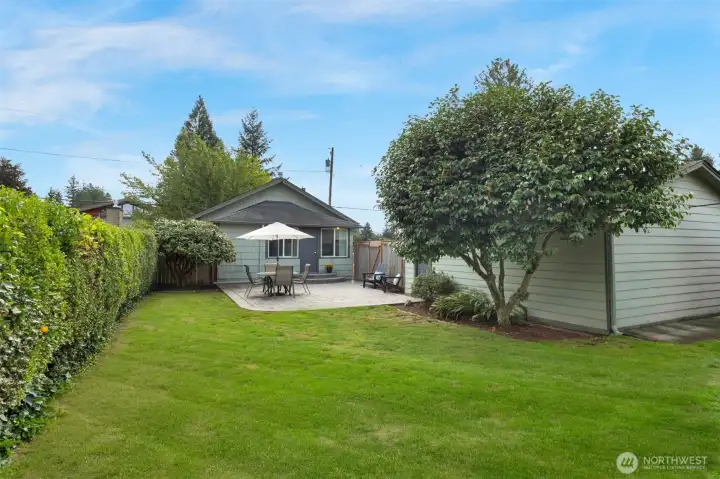 Large, private backyard & patio, fully fenced with alley access.