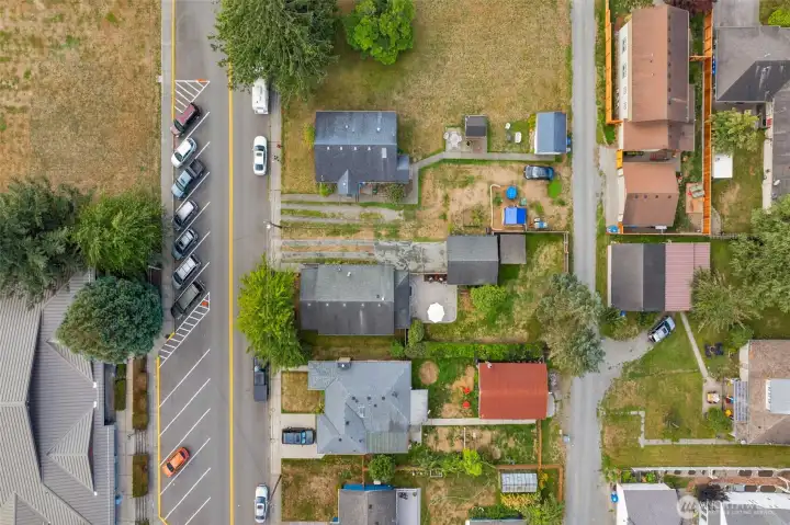 Prime location - across from the library, all new driveway gravel and alley access in back makes this lot turnkey!