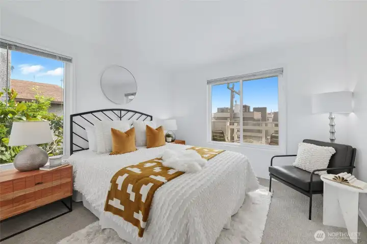 Bright primary bedroom with large closet.
