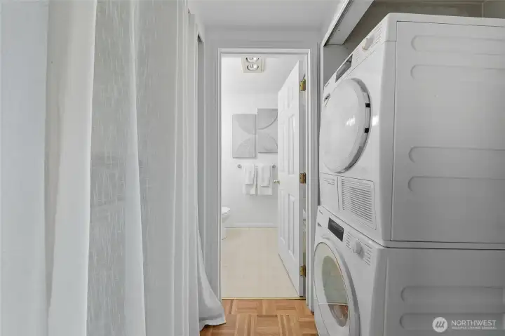 In-unit washer/dryer & behind that curtain can be a large pantry or just extra storage. You decide!