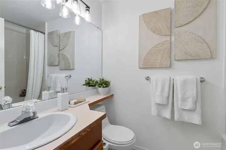 Full bathroom with brand new modern lighting.