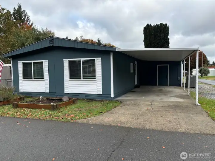 Double-wide with carport parking