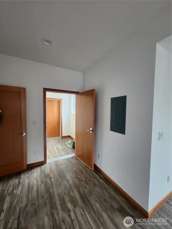 Private hallway at the top of the stairway to the upper units.