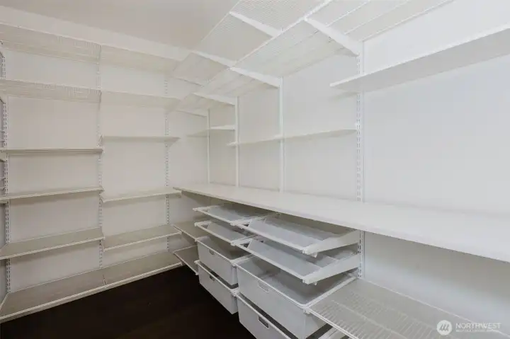 Expansive pantry w/ custom shelving.