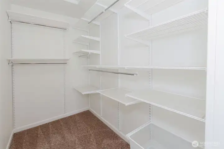 Primary bedroom walk in closet.
